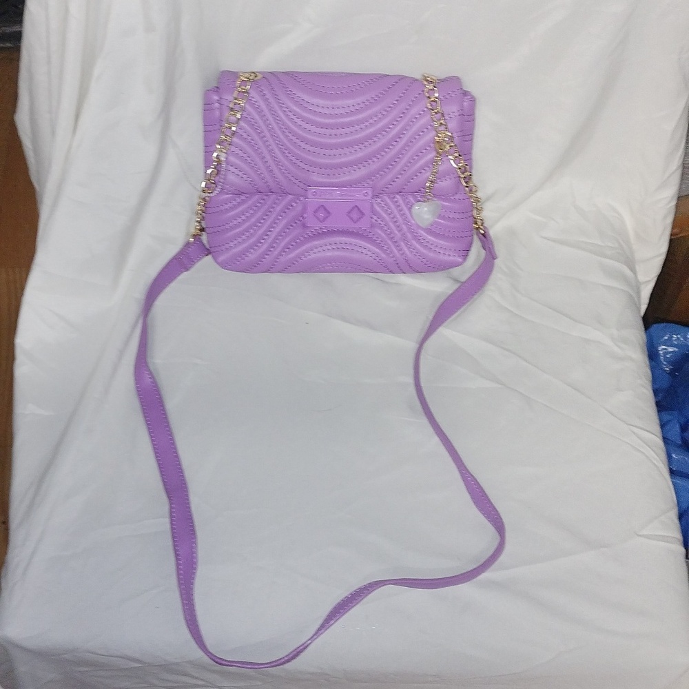Betsy Johnson small purple crossbody bag.